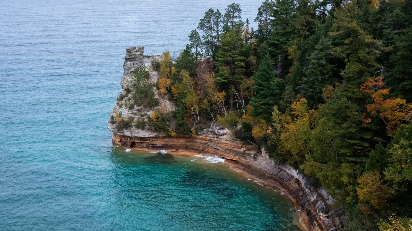 Autumn view of Pictured Rocks cliffs and turquoise water near Munising, Michigan